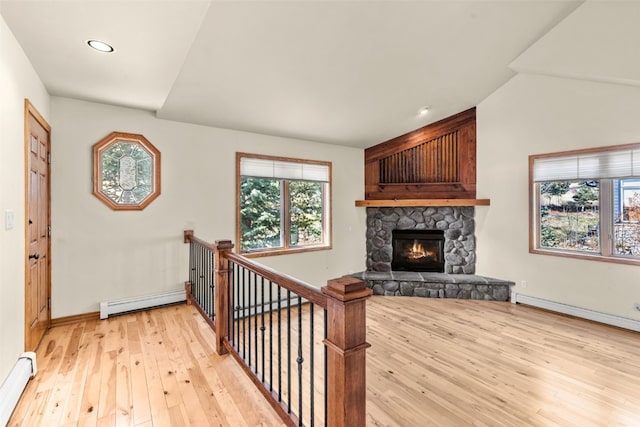 142 High Meadow Dr, Dillon, CO 80435 - foyer entrance with a baseboard heating unit, light wood-style flooring, a fireplace, baseboards, and recessed lighting