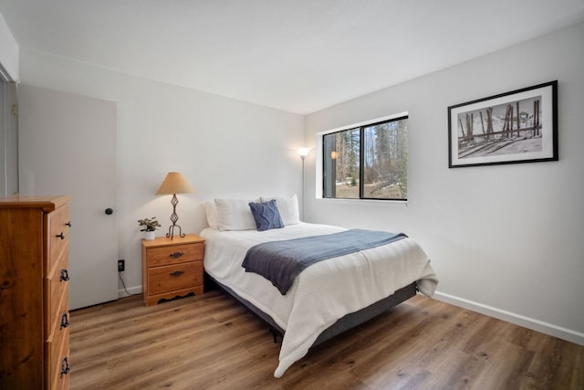 9876 Ryan Gulch Rd Unit 206, Silverthorne, CO 80498 - bedroom featuring wood finished floors and baseboards