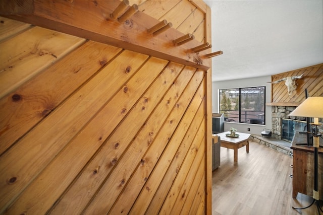 9876 Ryan Gulch Rd Unit 206, Silverthorne, CO 80498 - detailed view of wood finished floors and a stone fireplace