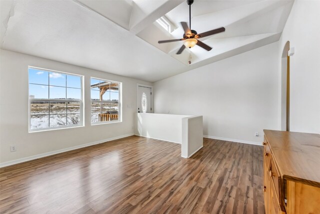 370 Stone Creek Dr, Fairplay, CO 80440 - interior space with wood finished floors, lofted ceiling, baseboards, ceiling fan, and arched walkways