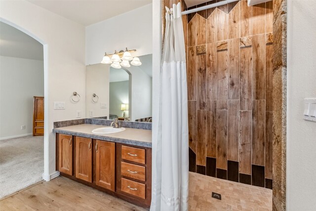 370 Stone Creek Dr, Fairplay, CO 80440 - full bathroom with vanity, a tile shower, and wood finished floors