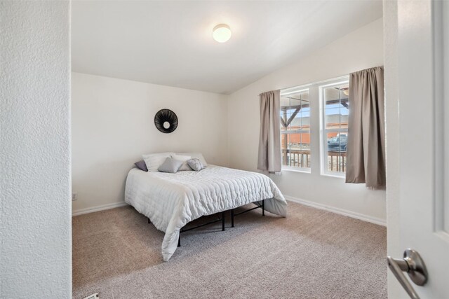 370 Stone Creek Dr, Fairplay, CO 80440 - bedroom featuring baseboards, carpet, and lofted ceiling