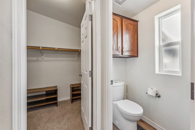 370 Stone Creek Dr, Fairplay, CO 80440 - bathroom featuring toilet, baseboards, visible vents, and a spacious closet