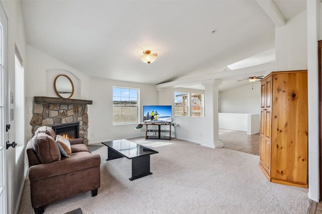370 Stone Creek Dr, Fairplay, CO 80440 - living room with a ceiling fan, decorative columns, a fireplace, baseboards, and carpet flooring