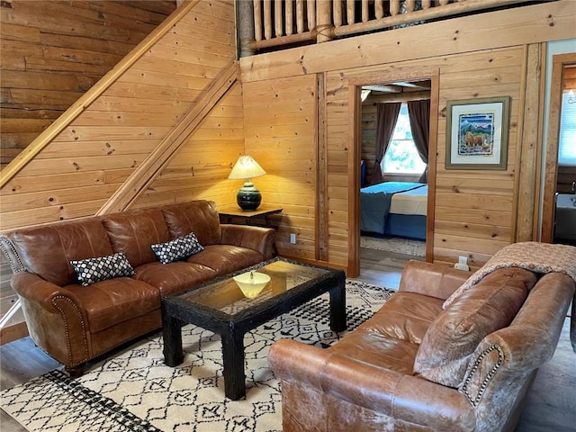 interior space featuring light hardwood / wood-style floors, wooden walls, and wood ceiling