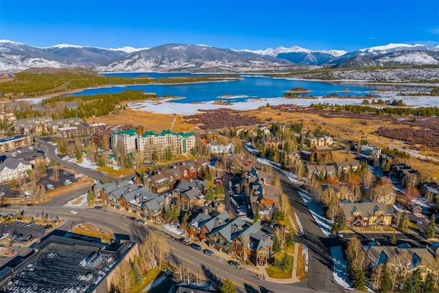 drone / aerial view featuring a water and mountain view