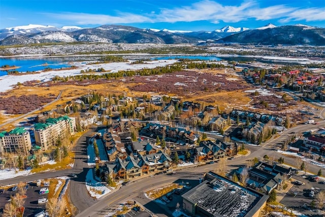birds eye view of property featuring a water and mountain view