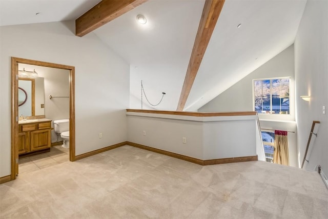 bonus room featuring light colored carpet, baseboards, vaulted ceiling with beams, and a sink