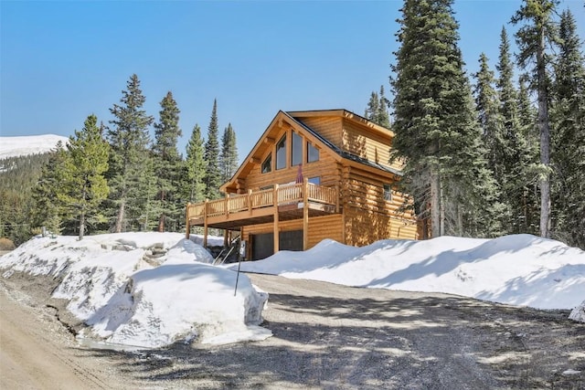 282 Sally Cir, Breckenridge, CO 80424 - view of snow covered exterior with a deck and log exterior