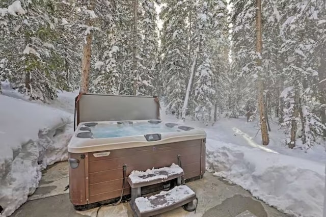 282 Sally Cir, Breckenridge, CO 80424 - snow covered patio featuring a hot tub