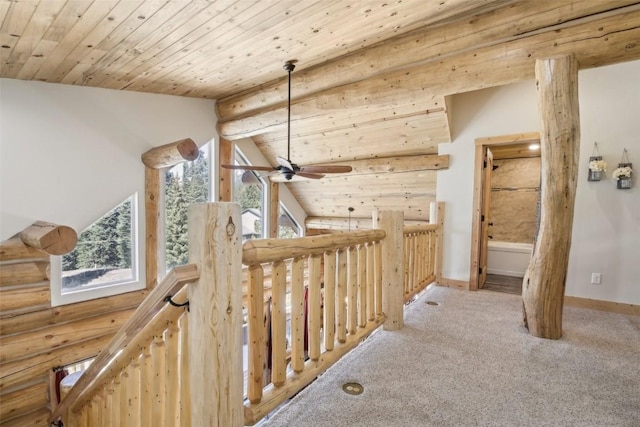 282 Sally Cir, Breckenridge, CO 80424 - hallway featuring an upstairs landing, log walls, wooden ceiling, carpet floors, and baseboards