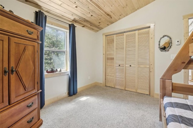 282 Sally Cir, Breckenridge, CO 80424 - bedroom featuring lofted ceiling, light colored carpet, a closet, baseboards, and wooden ceiling