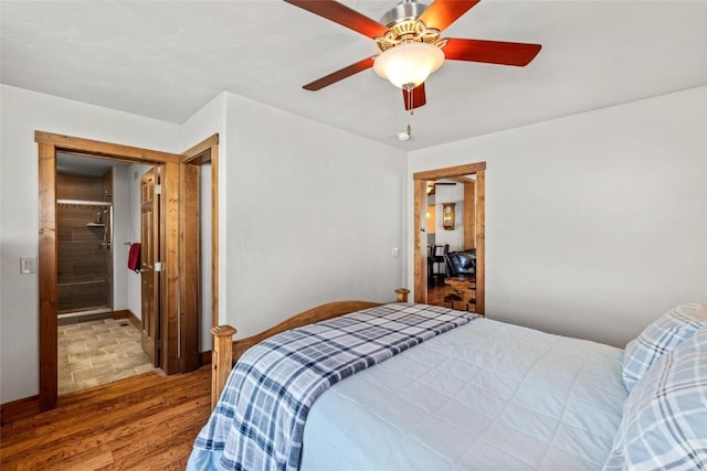 27100 Beaver Canyon Dr, Clark, CO 80428 - bedroom with wood finished floors, a ceiling fan, and baseboards