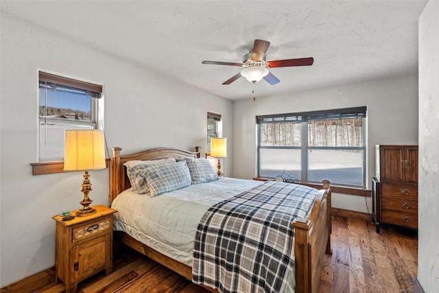 27100 Beaver Canyon Dr, Clark, CO 80428 - bedroom featuring wood finished floors, ceiling fan, and baseboards