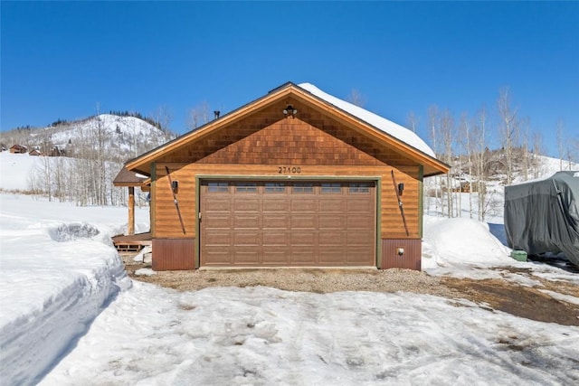 27100 Beaver Canyon Dr, Clark, CO 80428 - snow covered garage featuring a detached garage