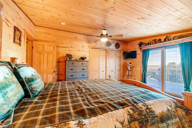 bedroom with wood ceiling, wooden walls, and access to outside