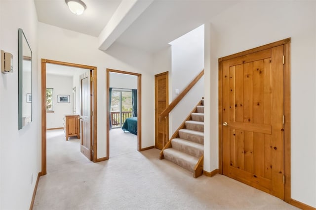 129 Lookout Ridge Dr Unit 129, Dillon, CO 80435 - entryway featuring light carpet and stairway