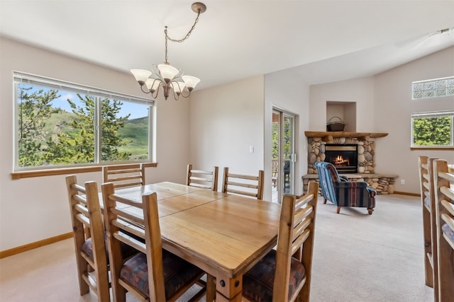 129 Lookout Ridge Dr Unit 129, Dillon, CO 80435 - dining space featuring a chandelier, light colored carpet, and healthy amount of natural light