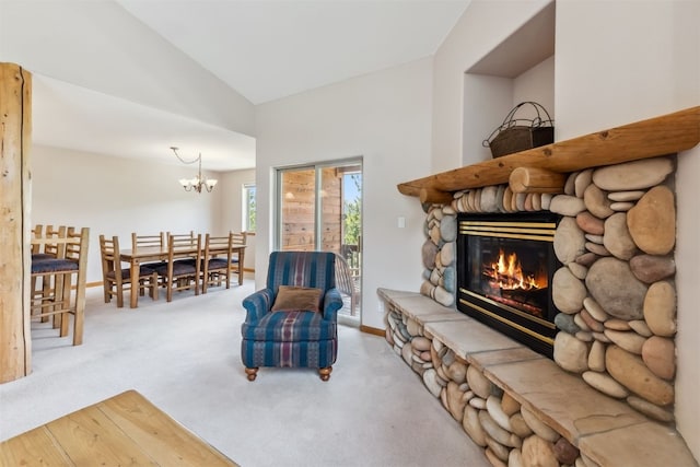 129 Lookout Ridge Dr Unit 129, Dillon, CO 80435 - carpeted living area with vaulted ceiling, a chandelier, and a stone fireplace