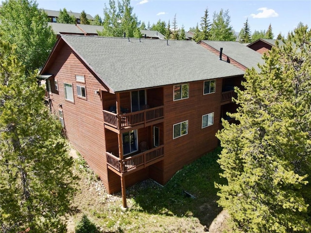129 Lookout Ridge Dr Unit 129, Dillon, CO 80435 - back of house with roof with shingles and a balcony