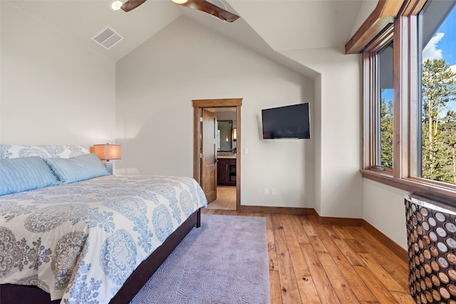 23 Verde Ct, Breckenridge, CO 80424 - bedroom with radiator heating unit, light wood-style flooring, baseboards, vaulted ceiling, and connected bathroom