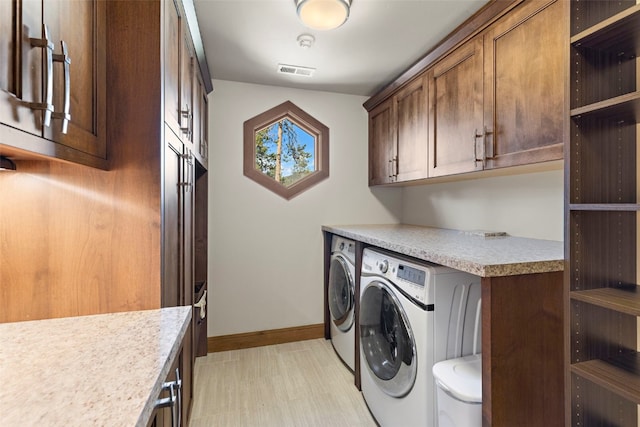 23 Verde Ct, Breckenridge, CO 80424 - laundry area with cabinet space, washing machine and clothes dryer, baseboards, and light wood-style floors