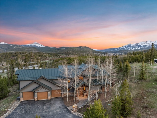23 Verde Ct, Breckenridge, CO 80424 - view of front facade with a mountain view, metal roof, and driveway
