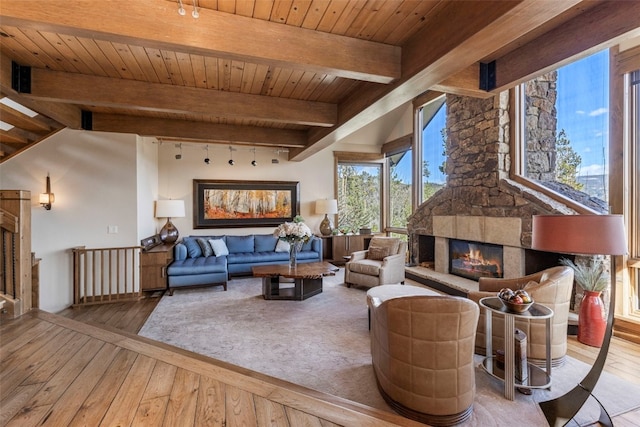 23 Verde Ct, Breckenridge, CO 80424 - living room featuring wood-type flooring, wood ceiling with exposed beams, track lighting, and a fireplace