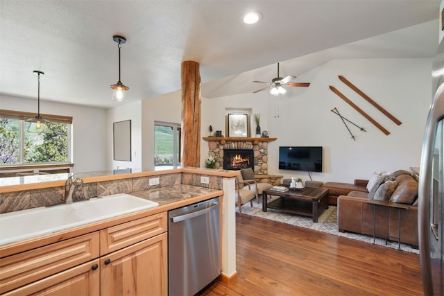 113 Lookout Ridge Dr, Dillon, CO 80435 - kitchen with appliances with stainless steel finishes, dark wood-style floors, open floor plan, a fireplace, and hanging light fixtures