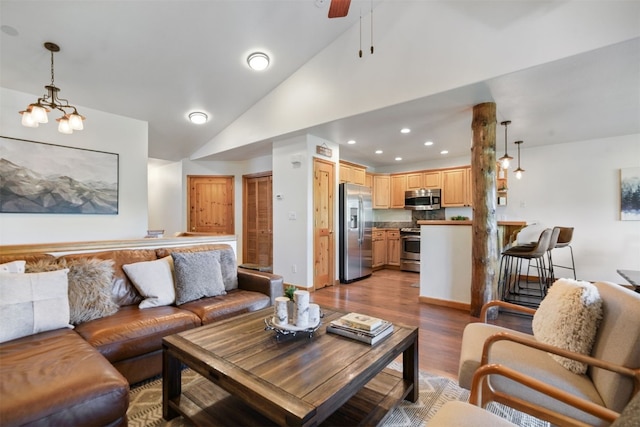 113 Lookout Ridge Dr, Dillon, CO 80435 - living area with vaulted ceiling, light wood finished floors, a ceiling fan, and recessed lighting