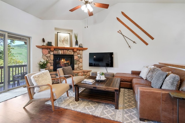 113 Lookout Ridge Dr, Dillon, CO 80435 - living room featuring lofted ceiling, ceiling fan, a stone fireplace, and wood finished floors