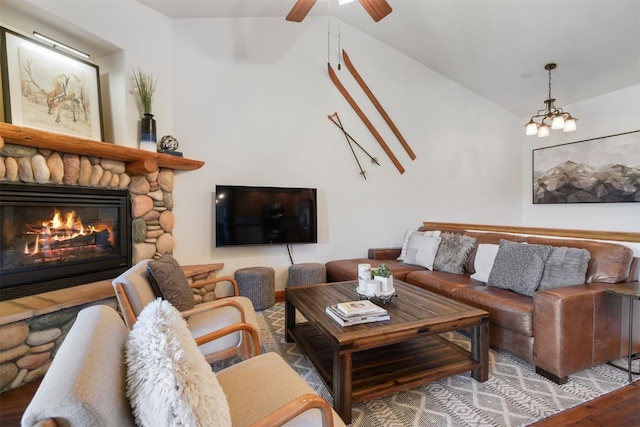 113 Lookout Ridge Dr, Dillon, CO 80435 - living area featuring vaulted ceiling, wood finished floors, a fireplace, and ceiling fan