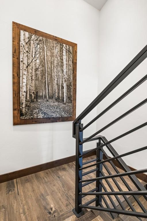 2355 Poma Ln Unit 2355, Steamboat Springs, CO 80487 - stairway featuring baseboards and wood finished floors