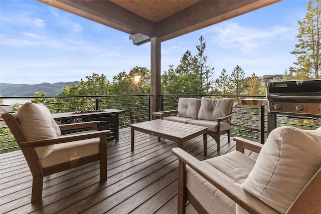 2355 Poma Ln Unit 2355, Steamboat Springs, CO 80487 - wooden deck featuring an outdoor hangout area and a mountain view