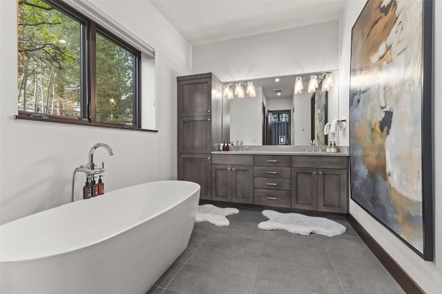 2355 Poma Ln Unit 2355, Steamboat Springs, CO 80487 - full bath with double vanity, a freestanding bath, and tile patterned floors