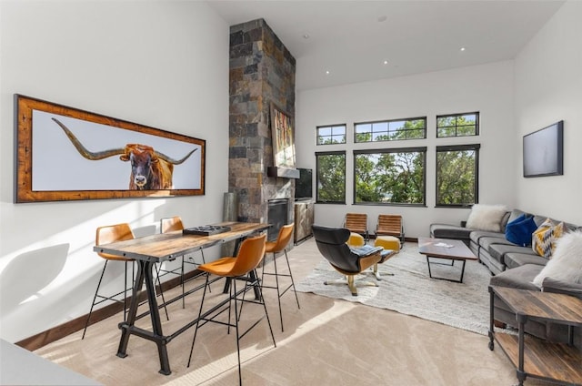 2355 Poma Ln Unit 2355, Steamboat Springs, CO 80487 - living area with a fireplace and a towering ceiling
