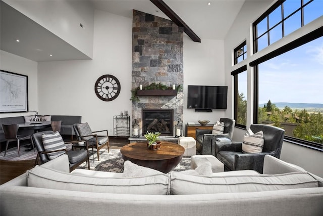 2355 Poma Ln Unit 2355, Steamboat Springs, CO 80487 - living area with wood finished floors, high vaulted ceiling, plenty of natural light, and a large fireplace