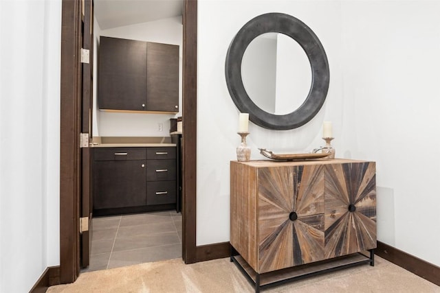 2355 Poma Ln Unit 2355, Steamboat Springs, CO 80487 - bathroom featuring baseboards, vanity, and vaulted ceiling