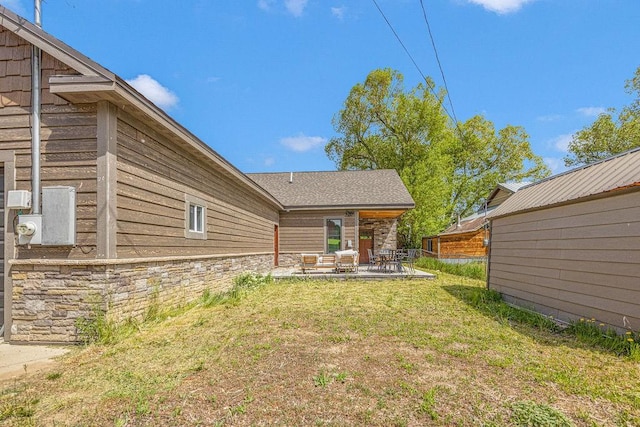 527 E Lincoln Ave, Hayden, CO 81639 - view of grassy yard featuring a patio