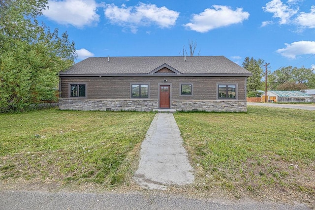 527 E Lincoln Ave, Hayden, CO 81639 - view of front of property with a front lawn, roof with shingles, and stone siding