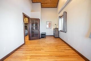 527 E Lincoln Ave, Hayden, CO 81639 - hallway with high vaulted ceiling, baseboards, and light wood-type flooring