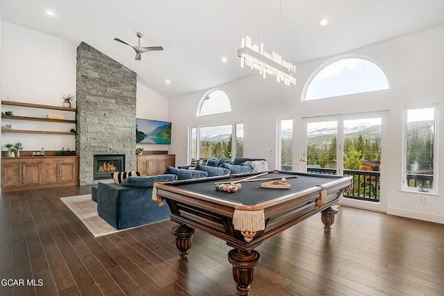671 Vasquez Rd, Winter Park, CO 80482 - recreation room with high vaulted ceiling, dark wood-style flooring, a stone fireplace, pool table, and ceiling fan
