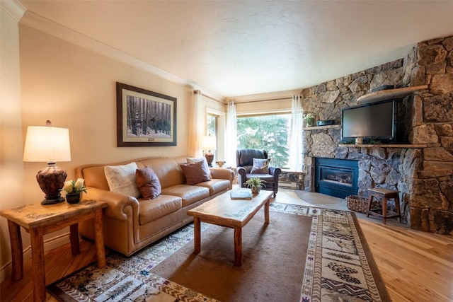 765 Columbine Rd Unit C203, Breckenridge, CO 80424 - living area featuring wood finished floors, a fireplace, crown molding, and a baseboard radiator
