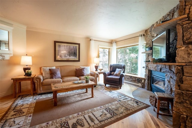 765 Columbine Rd Unit C203, Breckenridge, CO 80424 - living area with ornamental molding, a fireplace, wood finished floors, and a baseboard heating unit