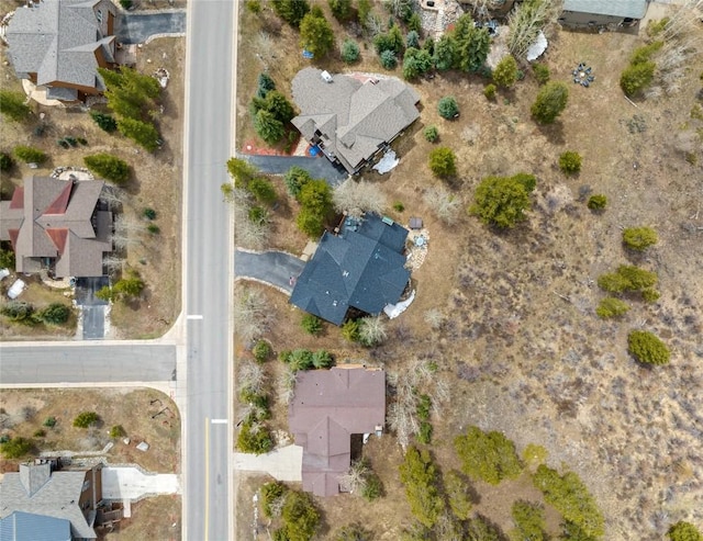 aerial view of property and surrounding area with nearby suburban area