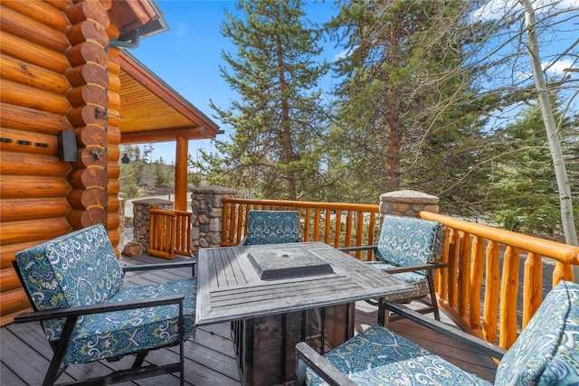 wooden terrace with outdoor dining area