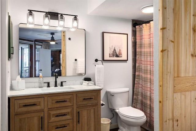 2700 Village Dr Unit D203, Steamboat Springs, CO 80487 - full bathroom featuring vanity, toilet, ceiling fan, and curtained shower