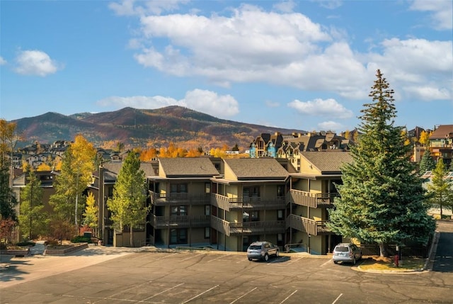 2700 Village Dr Unit D203, Steamboat Springs, CO 80487 - view of building exterior featuring uncovered parking, a mountain view, and a residential view