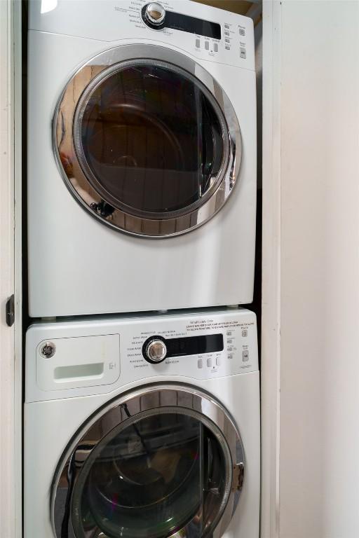 2700 Village Dr Unit D203, Steamboat Springs, CO 80487 - washroom featuring stacked washing machine and dryer