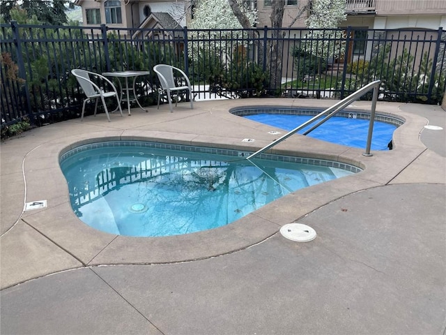 2300 Apres Ski Way Unit 12, Steamboat Springs, CO 80487 - view of swimming pool featuring a pool, a hot tub, and a patio area